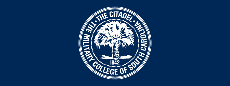 The Citadel seal in white on a navy blue background.